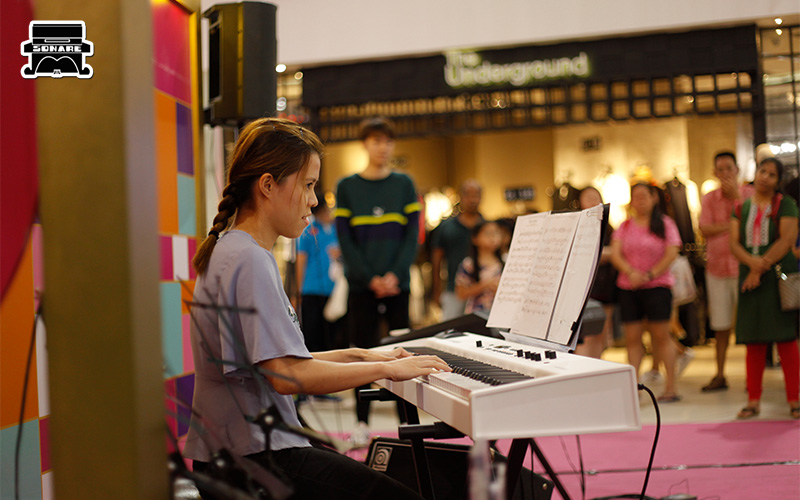 Sonare Music School student playing keyboard at recital.